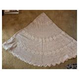 Hand crafted crocheted round table cover in a taupe color