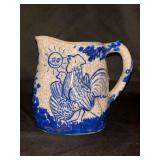 Antique Dedham Pottery "Day and Night" pitcher….. pitcher features a crackle glaze and cobalt blue decoration……4-3/4” tall