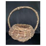 Primitive handwoven basket from possibly grapevine or willow twigs….from outside 12” x 10” x 12-1/2 to top of handle