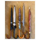 Grouping of wood handle umbrellas….most are in like new condition