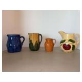 Grouping of (4) vintage pitchers in various sizes