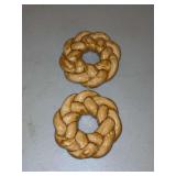 Ring-shaped ceramic designed to resemble a Polish Obwarzanek braided bread….3-1/4”D…..some of these were designed to become refrigerator magnets.