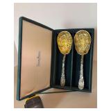 Vintage Godinger for Neiman Marcus silver plated serving spoons feature embossed bowls with a strawberry and floral motif finished in 24-karat gold plate and cast silver plate handles with repoussé f