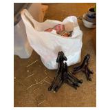 A bag full of plate hangers (new & used) and display stands