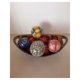 Vintage tin basket fill with various size tons made from various materials…..4 on top are ceramic and others are wood