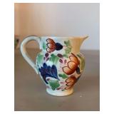 Gaudy Welsh miniature creamer, likely in the 'Oyster' pattern….. characterized by its colorful, hand-decorated folk-art style, often featuring cobalt blue, pink, peach, green, and gold luster…..3�