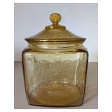 Vintage Federal Glass Amber Cookie Jar & Lid in Madrid Pattern…..7-1/2” tall….there is slight chipping around rim of jar (see pics)