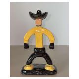 Vintage handcrafted folk art glazed ceramic figurine designed to look like a cowboy…..6-3/4” tall