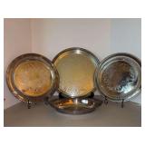 Grouping of silverplate serving pieces…..3 round trays are all Wm. Rogers with pierced edging and etched centers, oval tray is by Wilcox