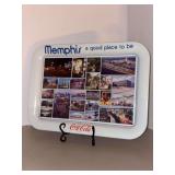 1984 Coca-Cola serving tray featuring various scenes of Memphis, Tennessee, including images of Elvis Presley, Mud Island, and Beale Street…..17-1/2 x 12-3/4