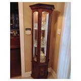 Lighted Curio Display Cabinet, mirrored back, 2 glass shelves, closed bottom compartment, dark finish. 70'T x 24' W x 10' D. Contents not included.