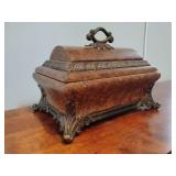 Vintage-style resin decorative box, velvet lined, ornate, antique appearance with decorative feet, and textured brown and bronze finishes, 9' T, 12 1/2' L x 8 1/2' W. Has some nicks.