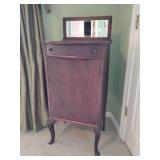 Antique Larkin sheet music cabinet,  beveled mirror top, a drawer for small items, and shallow interior shelves designed for storing sheet music, 44 1/2' T, 19 1/2' W x 17' D. Door doesn't shut just r