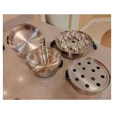 Stainless steel multi-purpose steamer set, for making idlis or steaming various foods. 12 pieces.