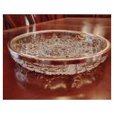 Daisy and Button pattern, silver tone rim, does have wear marks. 1 3/4' T x 10' across.
 Crystal divided relish or appetizer dish.