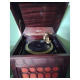 Edison S-19 Diamond Disc Phonograph. It works may need fine tuning. Hinge to disc cabinet broken and couple of chips see pics.