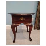 Mahogany end table, Queen Anne style, a single drawer and cabriole legs, oval top, one leg is worbley, few scratches, single drawer is so full won't open, still good looking, 23' T, 22' W x 25 1/2' L.