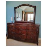 Dresser with beveled mirror, traditional, 9 drawers, height with mirror 79 1/2', dresser height 38 1/2', 70' W x 22' D.