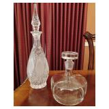 Princess House lead crystal decanter, teardrop shape, faceted design, matching elongated stopper, and a Romanian Glass Decanter.