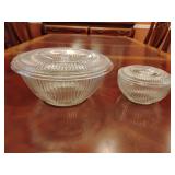 Anchor Hocking Jane Ray ribbed round clear refrigerator jars, large one 4 1/4'T, 10' across, small one 2 3/4'T, 5 1/2' across.