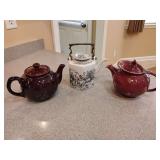 Vintage Brown Glaze Teapot, unmarked. Vintage Sigma 'Toile' porcelain teapot, featuring a hexagonal design with a black and white garden scene pattern and a brass handle. Vintage Hall China Co. Windsh