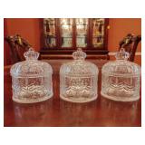 3 Glass jars featuring an intricate crown-shaped lid and embossed vintage patterns. 4'T x 3 1/2' across.