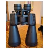 Zoom binoculars designed for long-range viewing.    Magnification: Variable zoom from 12x to 100x. Objective Lens Diameter: 70mm, allowing for significant light gathering. Field of View: 171 feet at 1