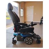 Pride Jazzy Air 2 Power Chair. 
Seat Elevation: Features a power elevating seat that raises 12 inches in 11 seconds. Works. Many add-on accessories. Other than a little grass on the wheels is relative
