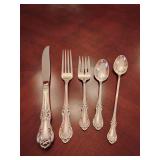 Sterling 'Wild Rose' pattern 5 piece place setting, knife, dinner fork, salad fork, dinner spoon, tea spoon. Weighs 144 grams.