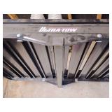 Ultra-Tow aluminum hitch cargo carrier with a ramp. 
Capacity: It has a 500-lb. weight capacity.
Material: Constructed from lightweight, durable aluminum.
Features: Includes an integrated ramp for eas