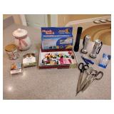 Candles, Scents, Handheld Sewing Machine, Thread, Flashlights, Scissors, Paperweight.