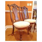 2 Haverty's Seville Formal Dining Chairs, back height 43 1/2', seat height 19', 25' wide, Upholstered in a traditional cream floral damask. 1 chair has scratch at base of back and the other has stain 