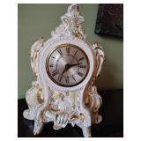 Vintage mantel clock white porcelain collectible piece with gold highlights and ornate rococo-style detailing, 11' T x 8' across, non-working.