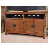 Signature Design by Ashley Cross Island Medium TV Stand, 29' T x 50' W x 20' D, 2 open shelves, 2 double door compartments with adjustable shelf, cut outs in the back, Mission Style.