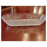 Indiana Glass Sandwich pattern clear oval celery dish, clear pressed glass design with floral and pebbled textures. 10 1/4' x 4 3/4'.