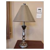 Hunter Table lamp featuring a theatrical faux-distressed candlestick resin base in silver and gilt finishes, 31' T, with smart plug, nice linen shade.