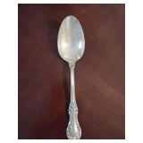 Sterling 'Wild Rose' pattern Serving Spoon weighing 64 grams.