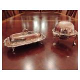 F.B. Rogers Silver Co. silver plate domed butter or caviar server and F.B.Rogers silver-plated covered butter dish features ornate detailing, a decorative handle, and footed legs.