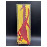 Authentic and original Mose T Folk Art Red Tiki Bird with signature soda can tab hanger…..5-1/2 x 15-1/4