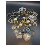 Grouping of earrings with no matches, broken necklace, men’s Wrangler watch with broken bezel and broken silverplate compact