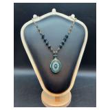 Nice looking longer necklace with compact pendant