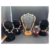 Grouping of wood beaded and shell necklaces