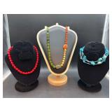 Grouping of (3) beaded necklaces…..red (short), multi-color (medium) and aqua (opera length)