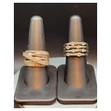 Grouping of (2) stacked silver-tone rings with clear stones…..left is size 9 (missing a stone) and right is size 7