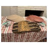 Mixture of placemats,  napkin rings, and a group of wall plate hangers