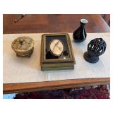Group of miscellaneous decor, very unique hinged bird box, 5 inch round gold dresser box, cast-iron piece is 3 1/2“ x 5 1/2 inches and a black blown glass of vase 4” x 5 3/4”
