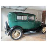 Green and Black 1929 Ford Model A.  Was restored in 1969/70. It is in running condition and was ￼recently serviced last fall.. It has a 4 cylinder flat head engine.