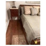 Sage green and gold comforter and pillows that fit a king size bed. Also included are the drapes