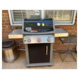 Weber three burner gas grill and cover with propane tank