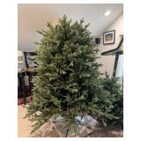 9 foot pre-lit fir tree. Unable to put top on to show due to ceiling height. ￼